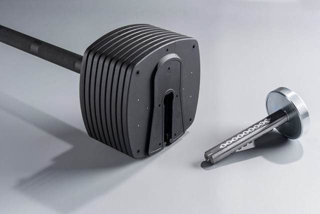 Close-up of the 100lb black adjustable dumbbell's weight plates.