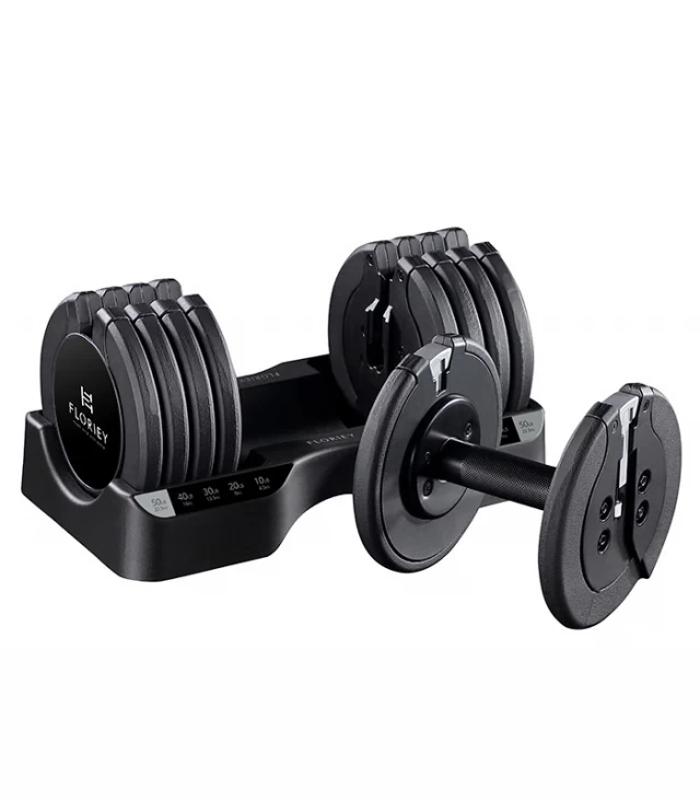 50lb black adjustable dumbbell set from T9 series resting in a storage cradle