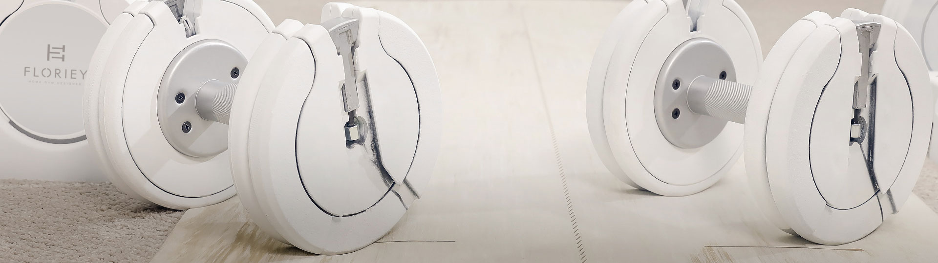 Floriey T9 Series 50 lb White Adjustable Dumbbell in white color on a sleek reflective surface.