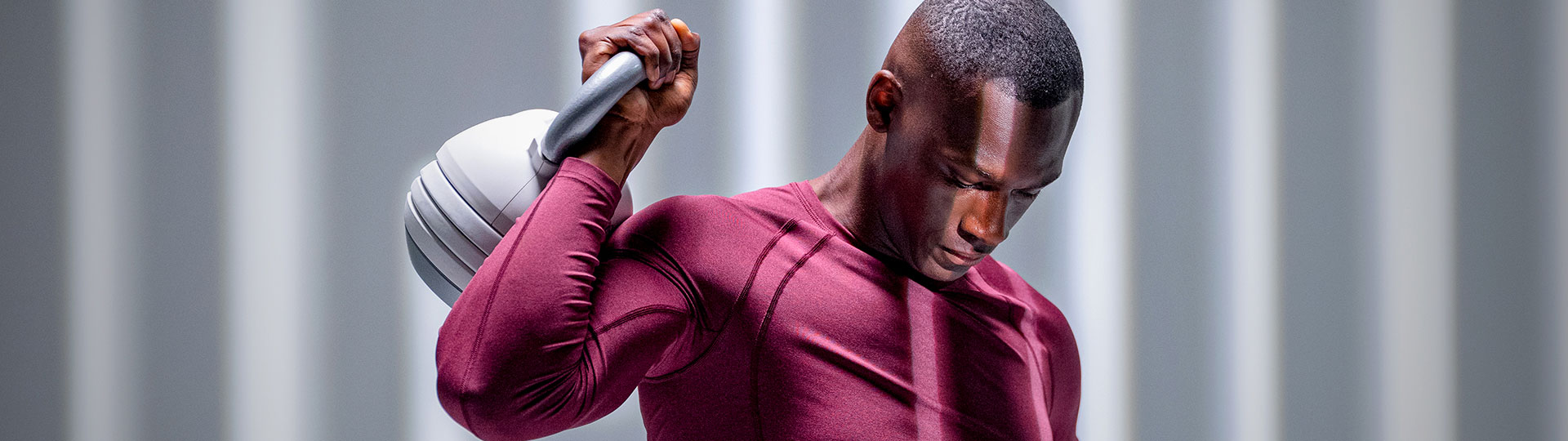 Person using a 30lb white adjustable kettlebell during a workout by Floriey